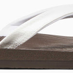Reef Women's Zen Love Sandal 2020 - A brown sandal with a tan strap and a small, circular logo on the toe strap.