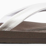 Reef Women's Zen Love Sandal 2020 - A brown sandal with a tan strap and a small, circular logo on the toe strap.