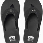 Reef Men's Fanning Sandal - A pair of black sandals with a strap and toe post, featuring a logo on the top strap.