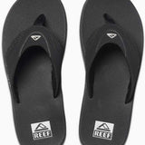 Reef Men's Fanning Sandal - A pair of black sandals with a strap and toe post, featuring a logo on the top strap.