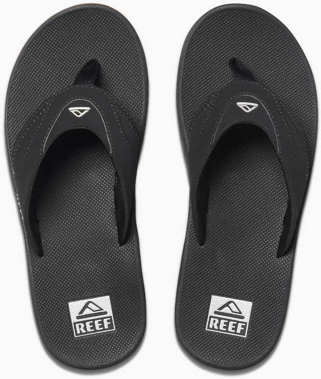 Reef Men's Fanning Sandal - A pair of black sandals with a strap and toe post, featuring a logo on the top strap.