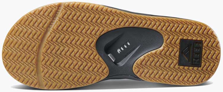 Reef Men's Fanning Sandal - A pair of brown sandals with a woven strap and a rubber sole.