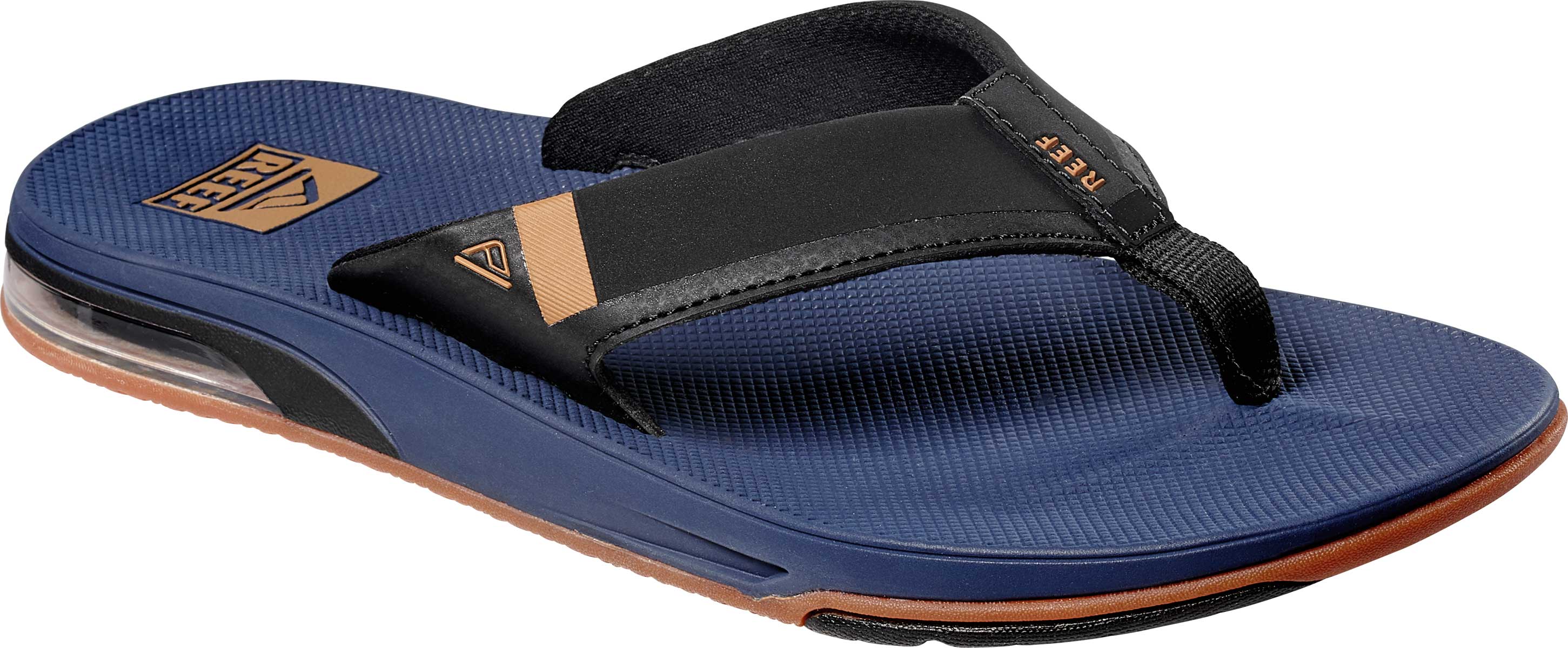 Reef Men's Fanning Low Sandal - A blue sandal with a brown logo on the strap and a clear sole.