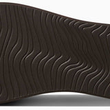 Reef Women's Bliss-Full Sandal - A brown sandal with a thick sole and wavy pattern on the bottom.