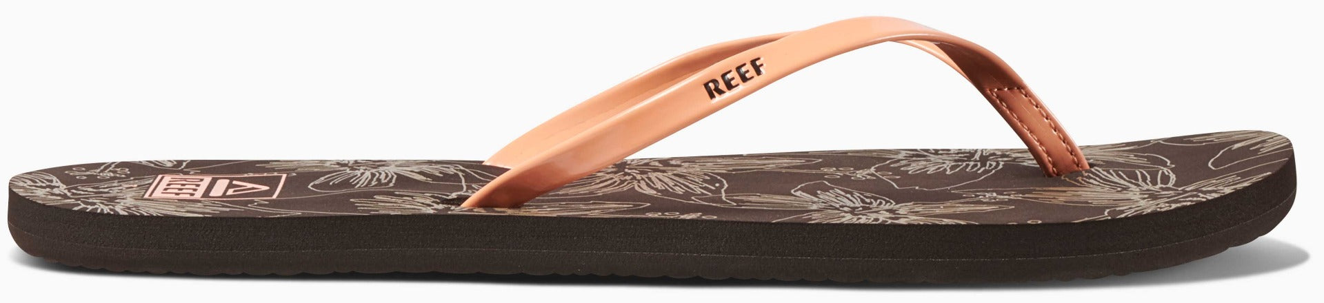 Reef Women's Bliss-Full Sandal 2020 - A brown sandal with a strap and toe post, featuring a palm tree design on the footbed.
