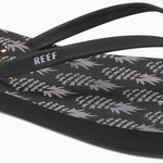 Reef Women's Bliss-Full Sandal 2020 - A pair of black sandals with a gold logo on the strap.
