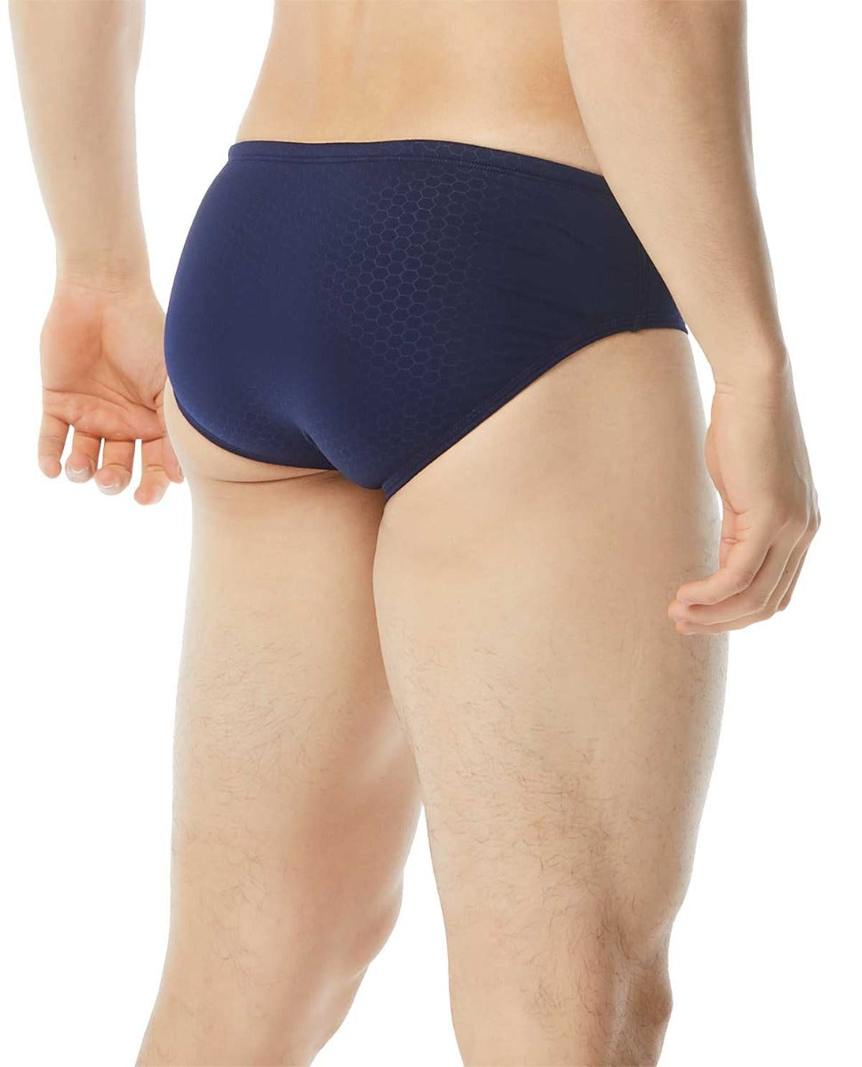 TYR Men's Hexa Racer Swimsuit - A navy blue swimsuit with a geometric pattern on the torso and textured fabric.