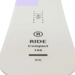Ride Women's Compact Snowboard 2023 - A white snowboard with a purple stripe at the top.