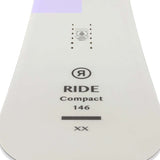 Ride Women's Compact Snowboard 2023 - A white snowboard with a purple stripe at the top.