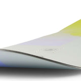 Ride Women's Compact Snowboard 2023 - A snowboard with a light purple top and yellow bottom, featuring a subtle white pattern on its surface.