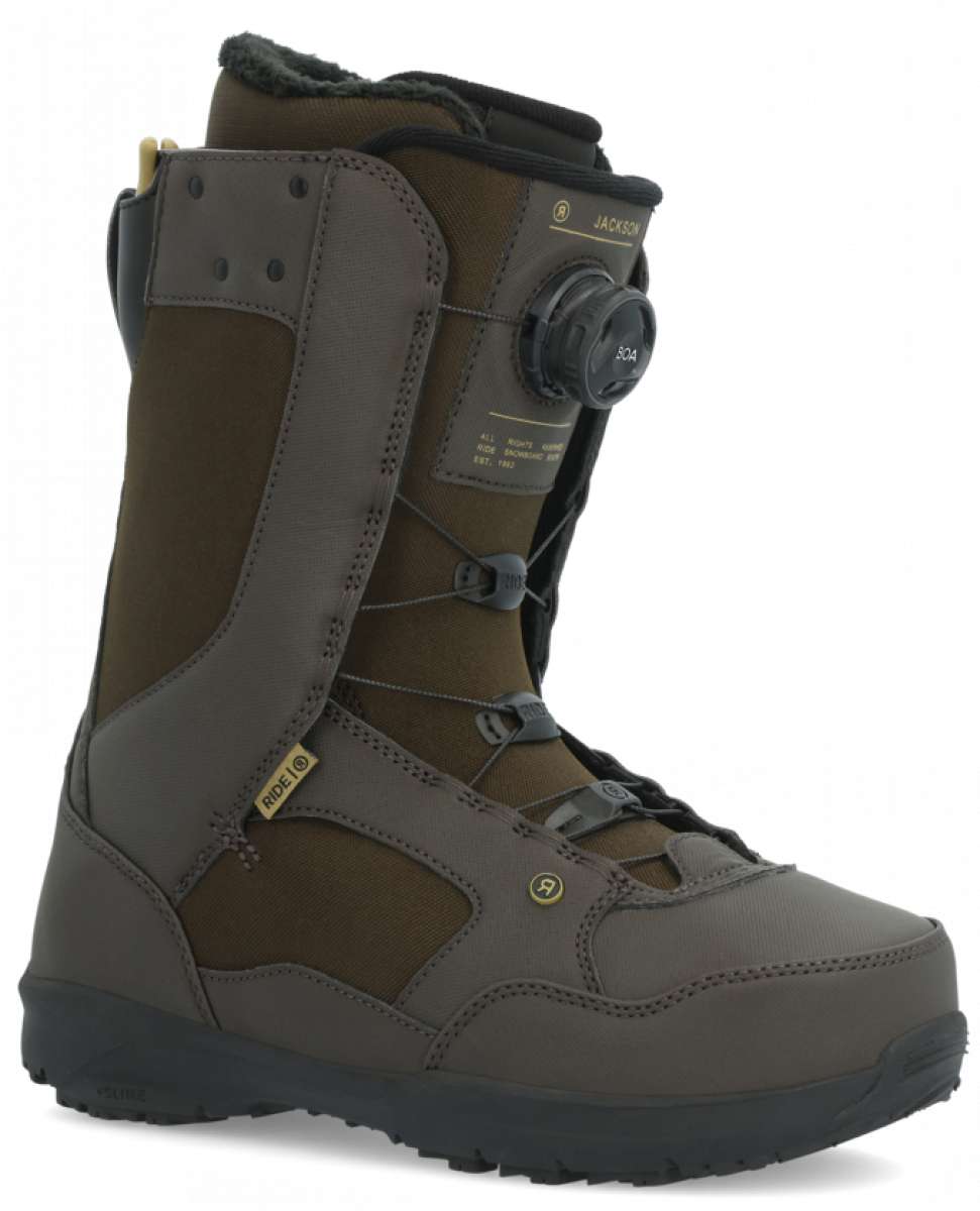 Ride Jackson Snowboard Boot 2024 - A brown snowboard boot with a black strap and laces, featuring a yellow logo on the side.