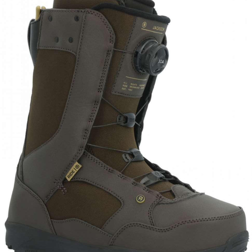 Ride Jackson Snowboard Boot 2024 - A brown snowboard boot with a black strap and laces, featuring a yellow logo on the side.