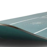 Ride Junior's Zero Snowboard 2024 - A dark green snowboard with white stripes and a logo on top.