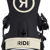 Ride Women's AL-6 Snowboard Binding 2023 - A black snowboard binding with a white logo featuring a stylized "R" inside a circle on top, and a cream-colored strap labeled "RIDE".
