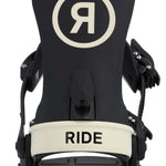 Ride Women's CL-6 Snowboard Binding 2023 - A black snowboard binding with a white "R" logo in a circle on top, and a cream-colored band at the bottom that says "RIDE".