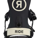 Ride Women's CL-6 Snowboard Binding 2023 - A black snowboard binding with a white "R" logo in a circle on top, and a cream-colored band at the bottom that says "RIDE".