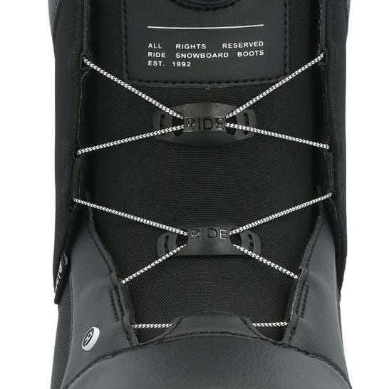 Ride Women's Harper Snowboard Boots 2024 - Black snowboard boots with a round black dial on the side and white stitching.