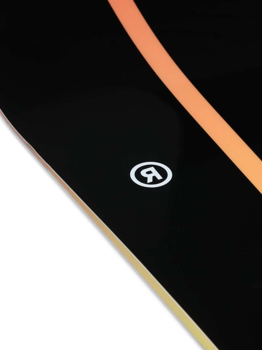 Ride Women's Heartbreaker Snowboard 2024 - A black snowboard with a white heart design on top of a brown background.