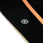 Ride Women's Heartbreaker Snowboard 2024 - A black snowboard with a white heart design on top of a brown background.