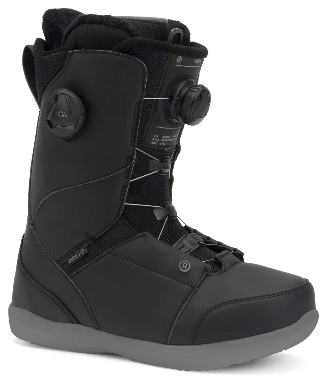Ride Women's Hera Pro Snowboard Boot 2022 - Black snowboard boot with a textured pattern on the side and a black strap with white writing that says "RIDE".