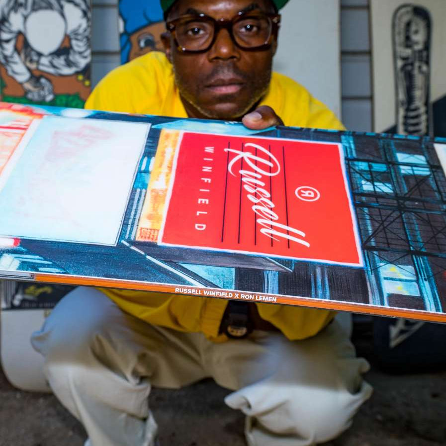 Ride Russell X Algoryhythm LTD Snowboard 2024 - A snowboard with a predominantly black base and white accents, featuring a distinctive Algorythm logo on top.