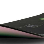 Ride Women's Saturday Snowboard 2024 - A black snowboard with a green and pink graphic on top.