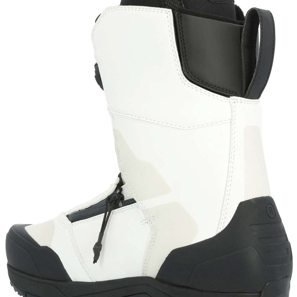 Ride Torrent Snowboard Boots 2024 - A pair of white snowboard boots with black accents and laces, featuring a textured rubber toe cap.