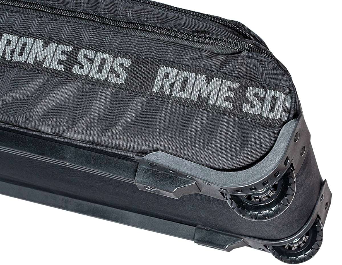 Rome Escort Wheelie Board Bag 2023 - Black bag with zippered top and handle on top, lying flat on a white background.