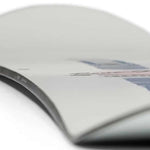 Rome Rene-Gade Snowboard 2024 - White snowboard with a black stripe down the middle and a red logo on top.