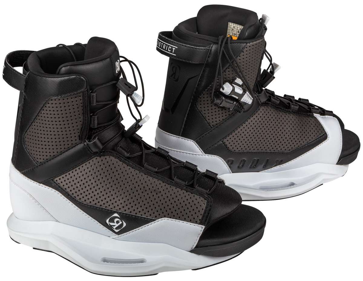 Ronix District Wake Boot 2023 - Black boots with white accents, featuring a textured pattern on the side and a strap at the top.