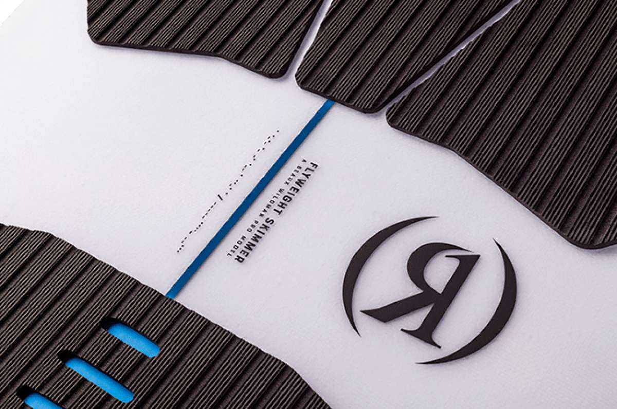 Ronix Flyweight Skimmer Wakesurf Board 2023 - A white wakesurf board with a blue stripe and black ridged textured top surface.