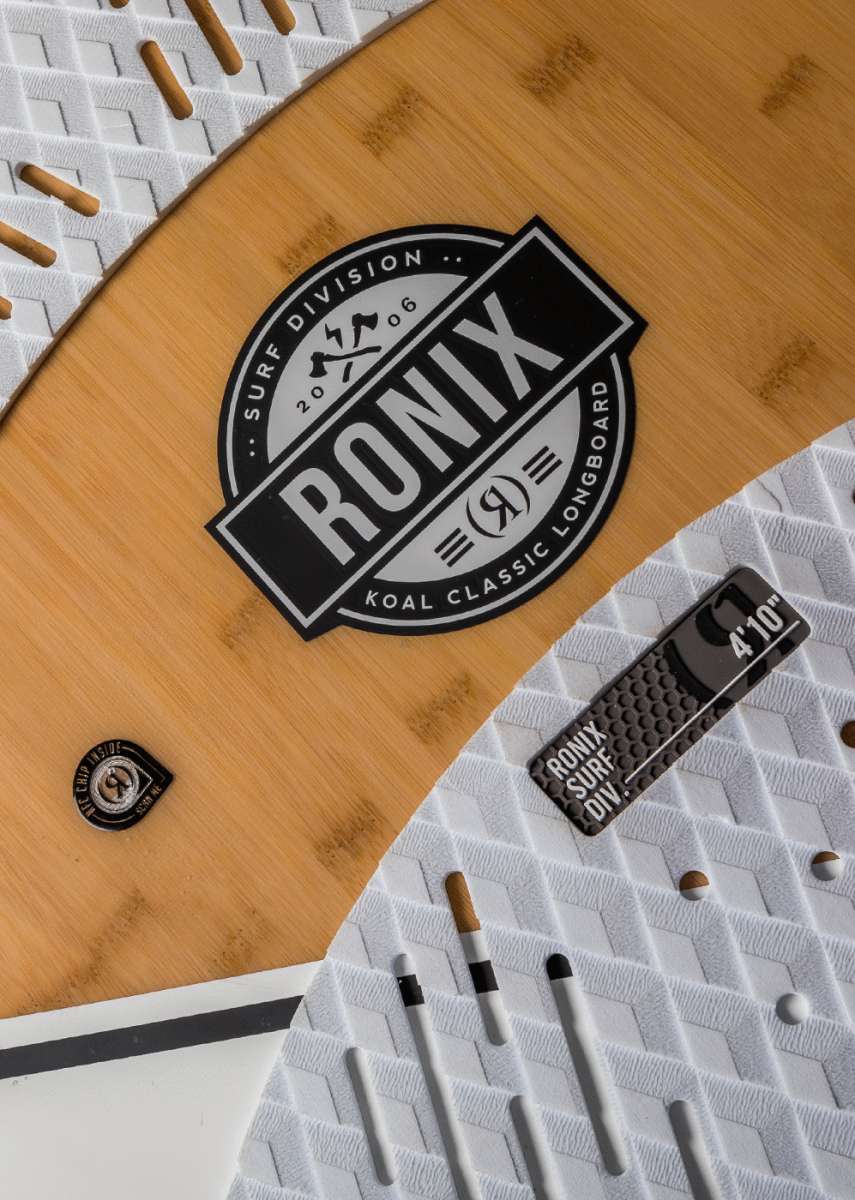 Ronix Koal Classic Longboard Wakesurf Board 2022 - A light brown longboard with a circular logo in the center featuring the word "RONIX" and a mountain graphic above it.