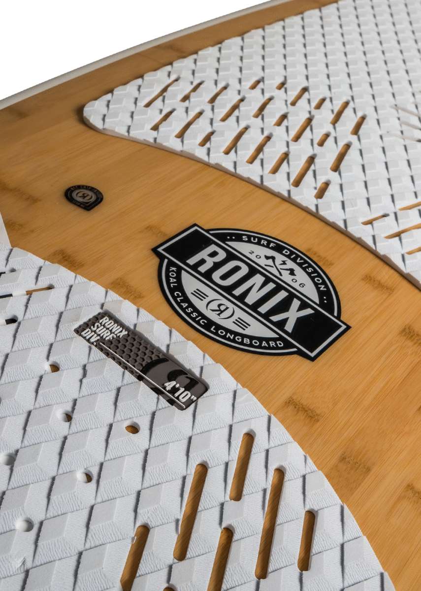 Ronix Koal Classic Longboard Wakesurf Board 2022 - A light brown longboard with a white geometric pattern on top and a black logo that says "RONIX" in large letters, with smaller text below it.