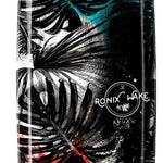 Ronix Ladies Krush Wakeboard 2022 - A black wakeboard with a white logo and a woman riding it in the background.