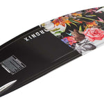 Ronix Ladies Quarter 'Til Midnight Wakeboard 2022 - A black wakeboard with a vibrant floral design featuring pink, orange, and green flowers on the top half.