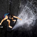 Ronix Party Impact Wake Vest 2022 - A black wake vest with a blue and pink stripe on the back strap.