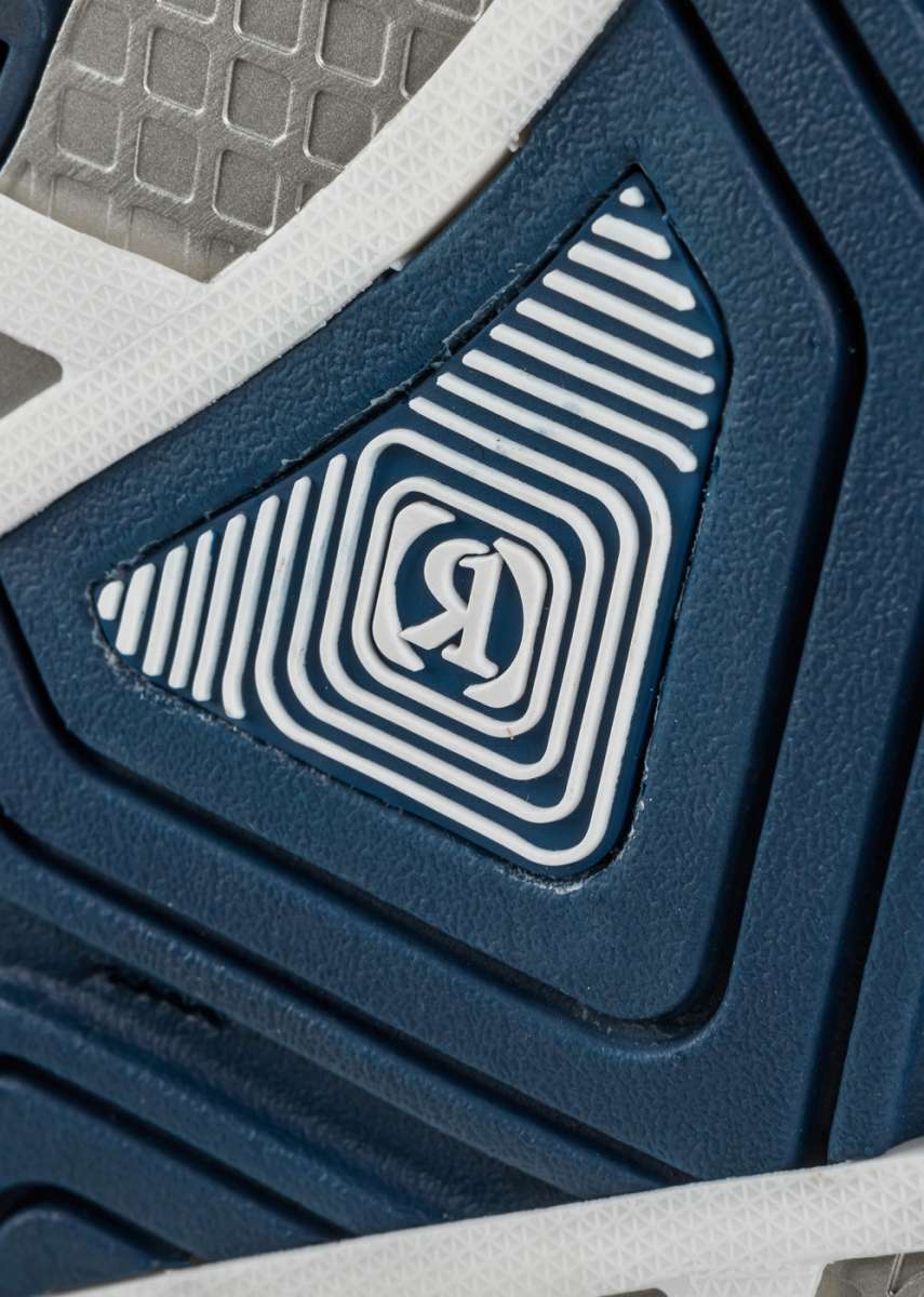 Ronix RXT Intuition+ Wake Boot 2022 - A pair of blue and white wakeboarding boots with a textured pattern on the side.