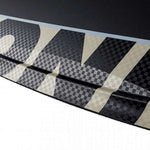 Ronix Supreme Air Core 3 Wakeboard 2023 - A black and white wakeboard with a checkered pattern on its top side.