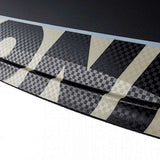 Ronix Supreme Air Core 3 Wakeboard 2023 - A black and white wakeboard with a checkered pattern on its top side.