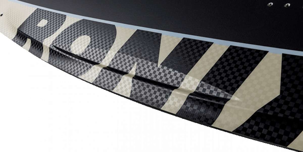 Ronix Supreme Air Core 3 Wakeboard 2023 - A black and white wakeboard with a checkered pattern on its top side.