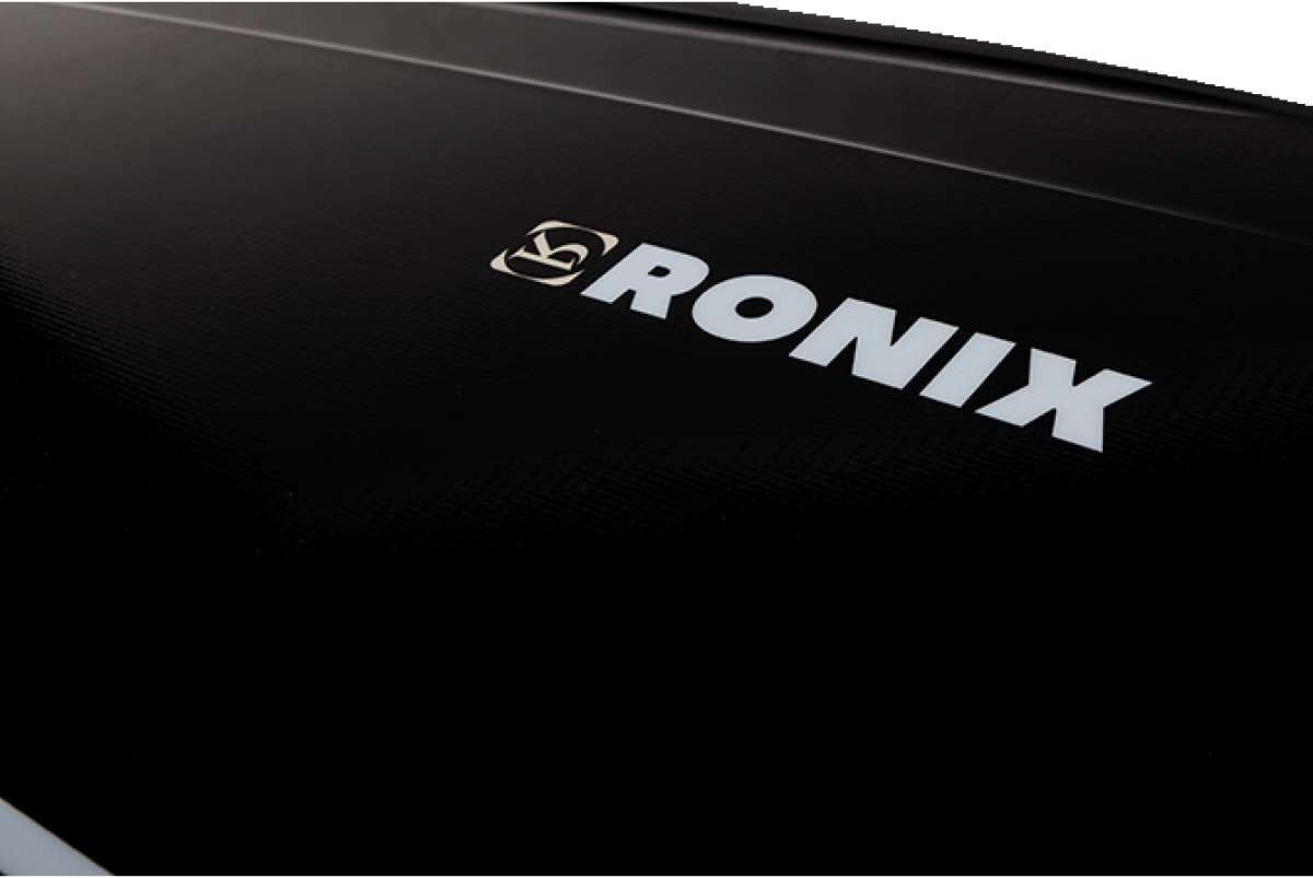 Ronix Supreme Air Core 3 Wakeboard - A black wakeboard with a white logo featuring a stylized "R" and "N" intertwined, positioned near the top of the board.