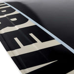 Ronix Supreme Air Core 3 Wakeboard - A black wakeboard with a white logo and text on top, featuring a textured pattern on its surface.