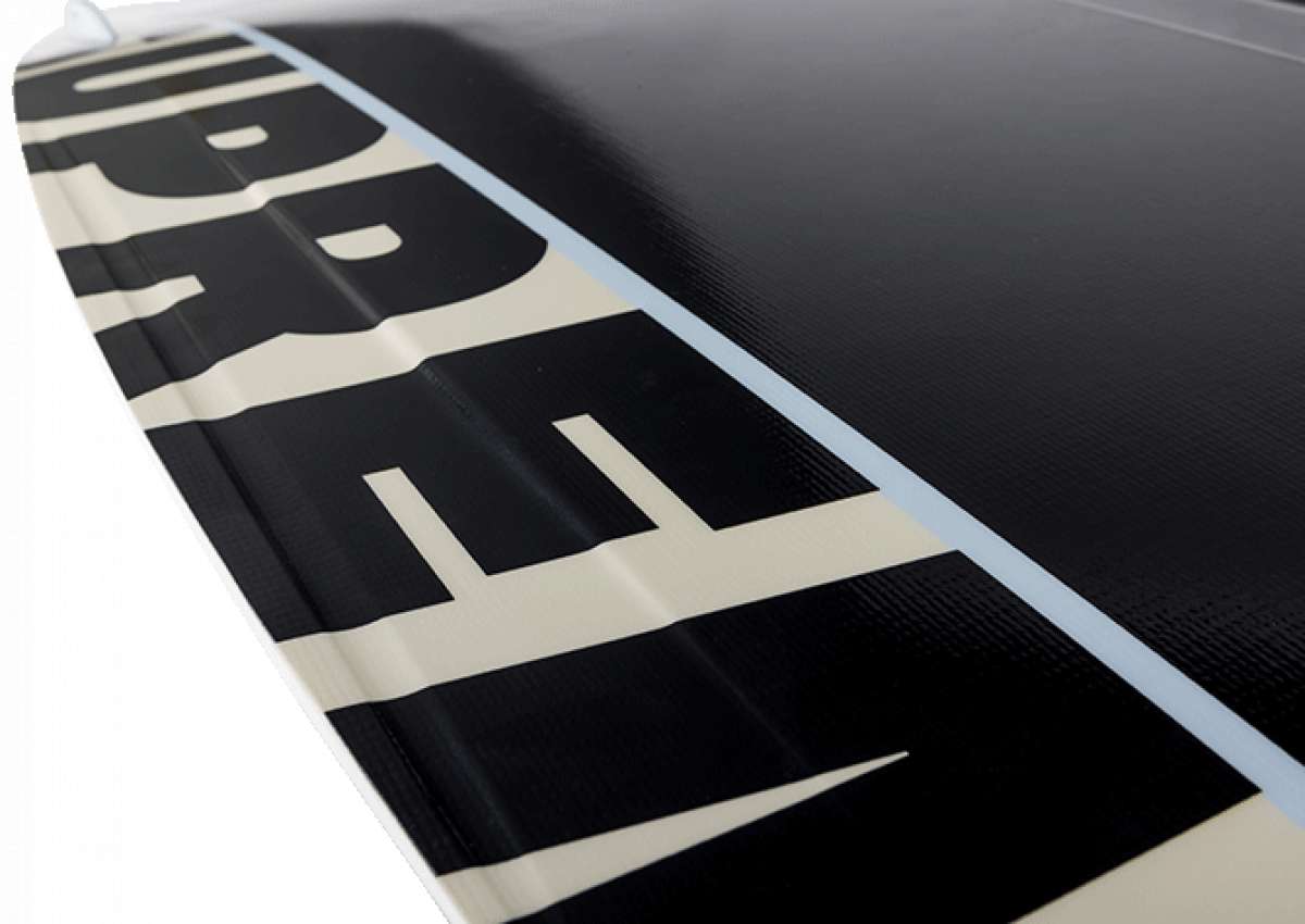 Ronix Supreme Air Core 3 Wakeboard - A black wakeboard with a white logo and text on top, featuring a textured pattern on its surface.