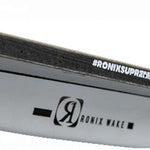 Ronix Supreme Air Core 3 Wakeboard 2023 - A white wakeboard with a black logo on its top edge and a small black square near the tip.