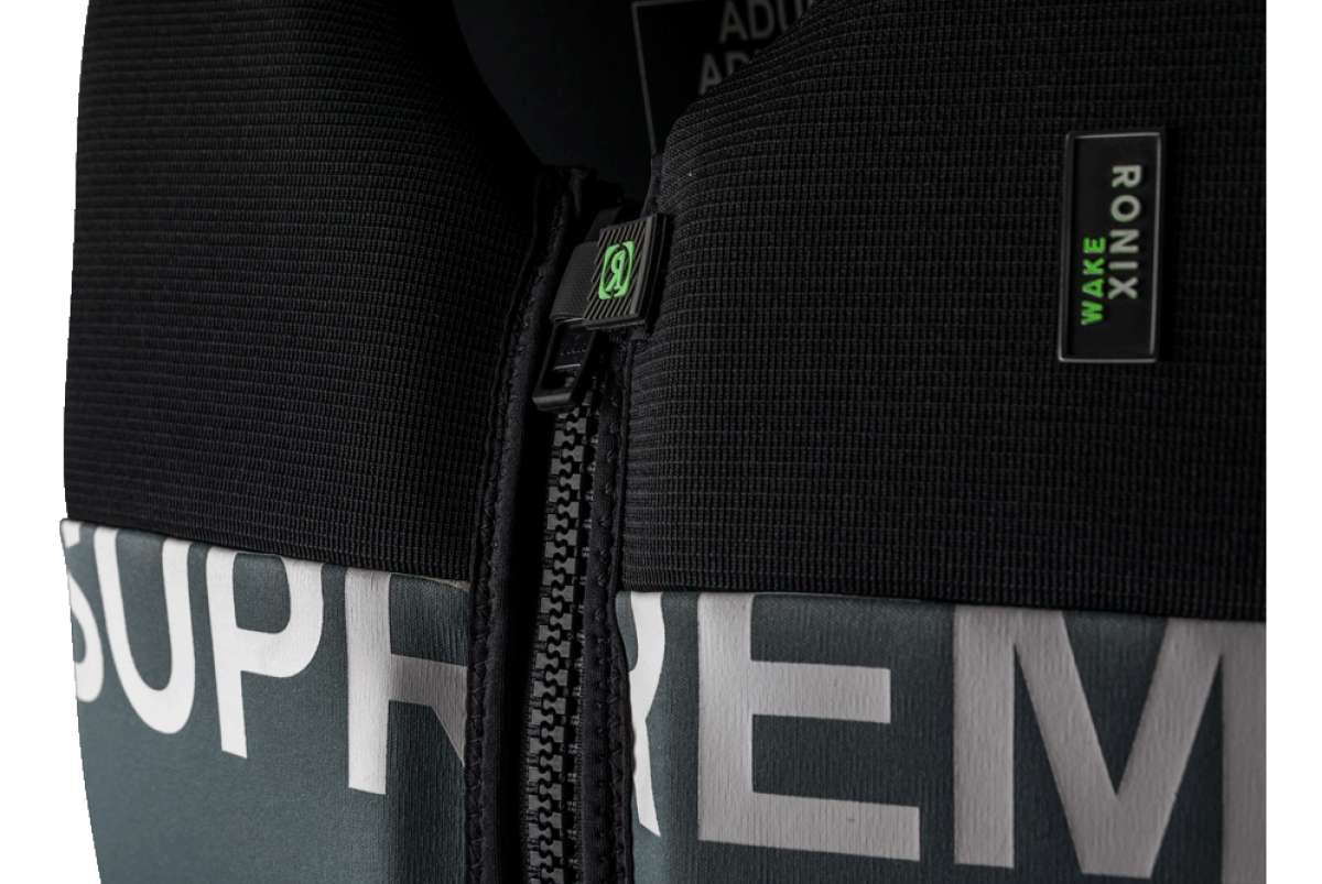 Ronix Supreme Yes CGA Wake Vest 2022 - A black vest with a white logo on the chest and a red tag attached to the zipper.