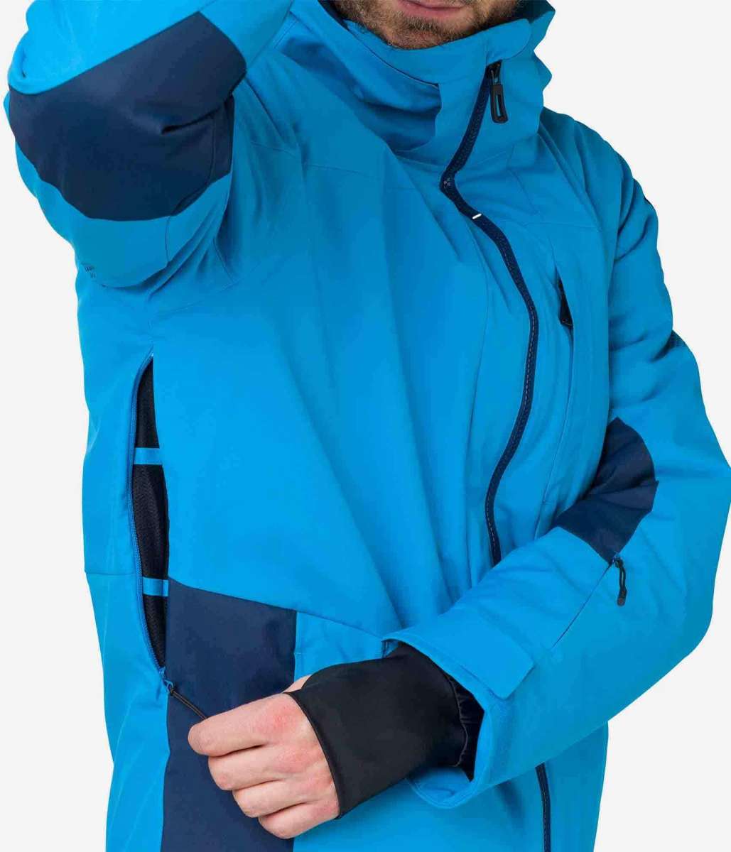 Rossignol All Speed Insulated Jacket 2022-2023 - A bright blue jacket with a black zipper and two zippered pockets on either side.