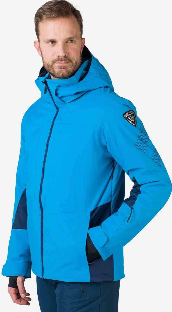 Rossignol All Speed Insulated Jacket 2022-2023 - A bright blue jacket with a black zipper and two zippered pockets on either side.