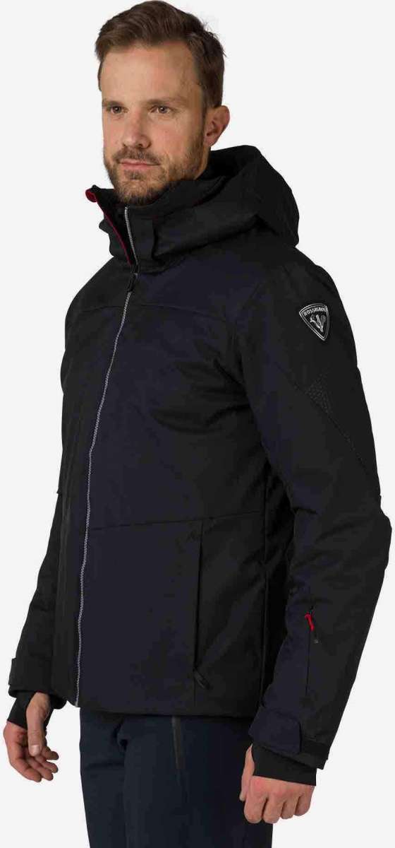 Rossignol All Speed Insulated Jacket 2022-2023 - A black jacket with a white logo on the left sleeve and red zipper pull.