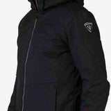 Rossignol All Speed Insulated Jacket 2022-2023 - A black jacket with a white logo on the left sleeve and red zipper pull.