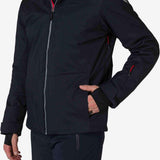 Rossignol All Speed Insulated Jacket 2022-2023 - A black jacket with a silver zipper and red accents on the side pockets.